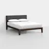 A modern bed with a dark wooden frame, angled legs, a dark gray upholstered headboard, and white bedding with two pillows, set in a minimal, light-colored room.