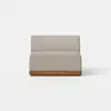 A modern, armless beige upholstered loveseat with a wooden base, set against a plain white background.