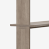 Close-up of a wooden shelf attached to a vertical wooden support, showing the joinery and natural wood grain, against a plain white background.