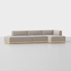A modern, light grey sectional sofa with clean lines and a wooden base, set against a plain white background. The sofa has three square seat sections and a right-side chaise lounge.