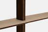 A close-up view of intersecting dark wooden beams with a beige, textured surface on the horizontal beam, set against a plain white background.