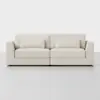 A modern, light beige fabric sofa with two seat cushions, two back cushions, and two matching rectangular throw pillows, set against a plain white background.