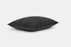 A black, rectangular quilted pillow is shown against a plain white background.
