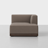 A modern, brown upholstered corner sofa with clean lines and a low wooden base, positioned on a light gray floor against a plain white background.