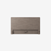 A rectangular, light brown wooden headboard with a simple, modern design and a horizontal cutout near the bottom center, set against a plain white background.