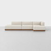 A modern, L-shaped sectional sofa with cream-colored upholstery and a low wooden base, set against a plain white background.