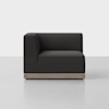 A modern left-arm sofa chair with dark gray upholstery and a light wood base, placed on a smooth light gray floor against a plain white background.