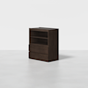 A dark brown wooden cabinet with two open shelves on top and two large drawers below, standing on a light gray floor against a plain white background.