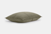 Olive green, rectangular pillow with visible stitching, resting on a white background.