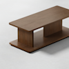A rectangular wooden coffee table with a smooth surface, two wide vertical supports, and a matching base, placed on a light gray floor.