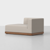 A modern chaise lounge with light gray upholstery, a low backrest on one side, and a wooden base, set against a plain white background.