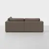 A modern, brown, L-shaped sectional sofa is shown from the back against a plain white background. The sofa has clean lines and plush back cushions.