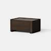 A modern, rectangular wooden coffee table with a dark brown finish, smooth surfaces, and rounded corners, placed on a light gray floor against a plain white background.