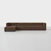 A modern, low-profile sectional sofa in brown fabric with a left-facing chaise lounge, set against a plain white background and a light gray floor.