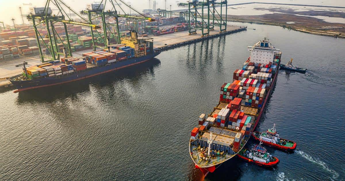 freight ship on the water during the day