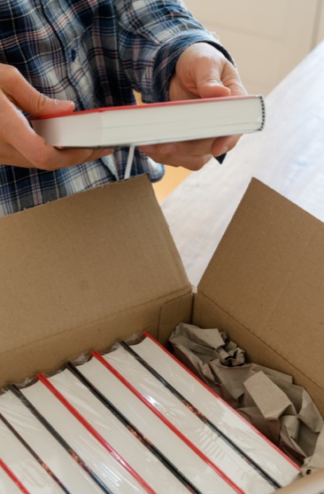Publisher packing books into a box