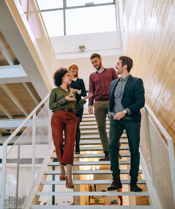 Partners walking down a staircase 