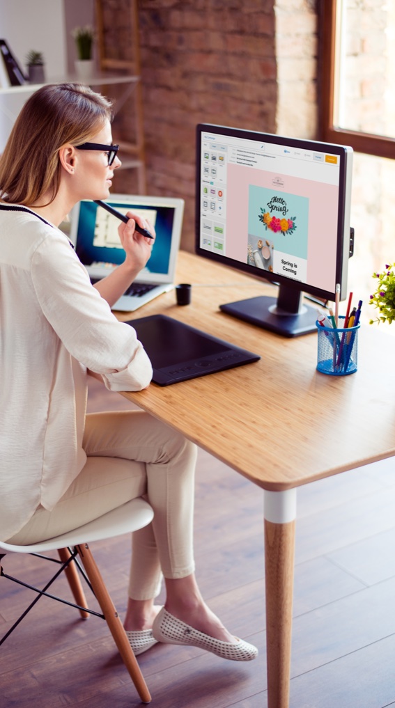 image of woman on a computer working on an email campaign