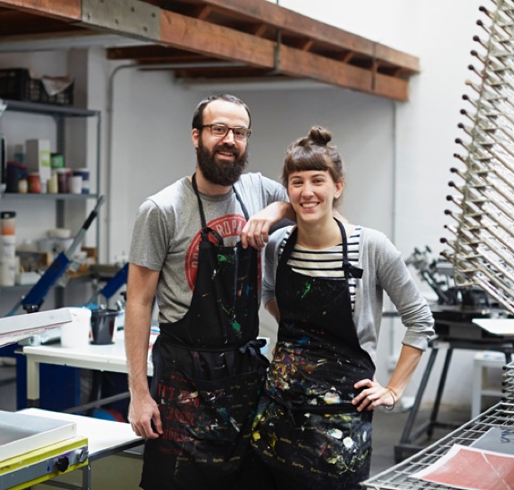 couple in aprons at studio