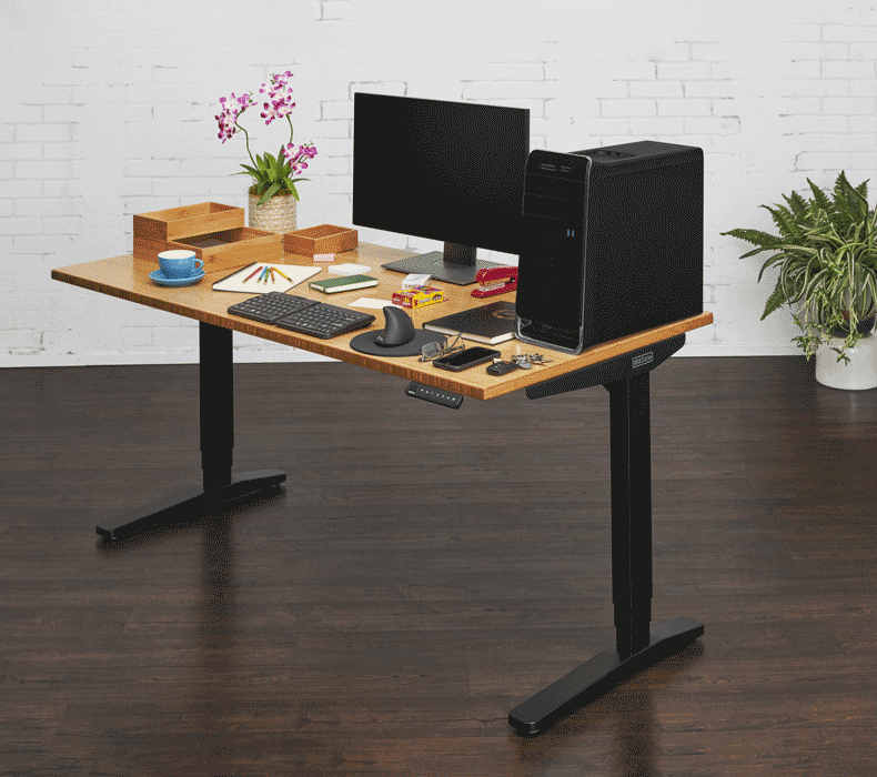 Animation of a desk extension being added to a crowded desktop, the computer tower moving to and then below the extension, and the other accessories moving onto the shelf