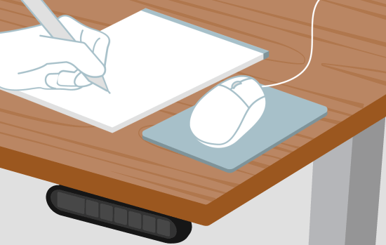 A hand draws on a notepad to protect the desktop from scratches and indentations.