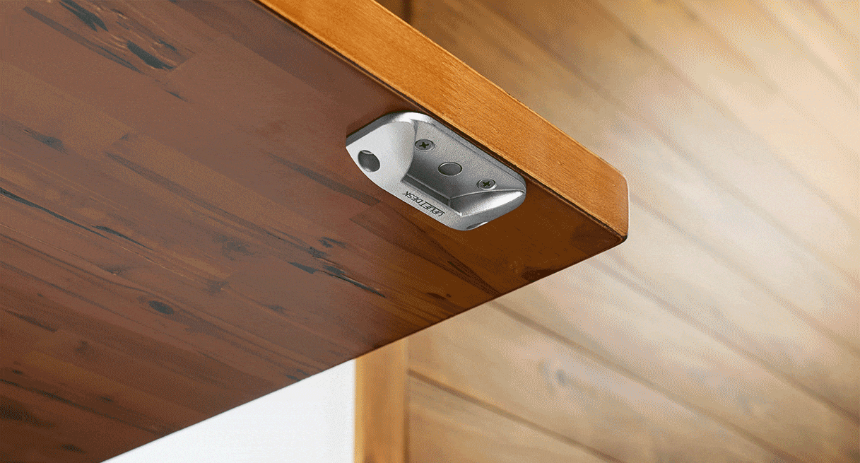 Bottle Opener installed underneath a desktop with bottle cap attached to magnet