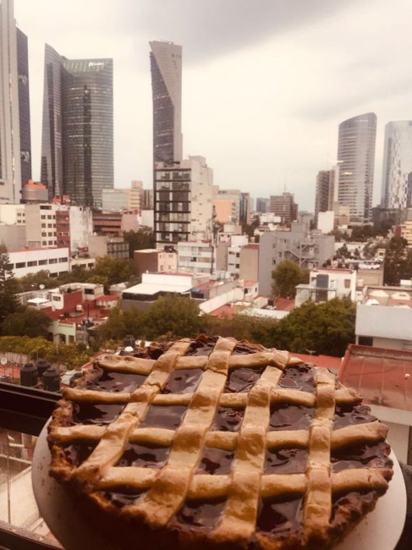 Our Pasteleria Suiza cherry pie and view of Mexico City from the Airbnb