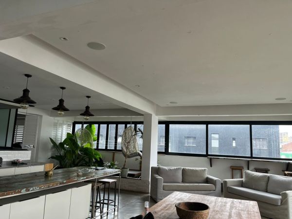 Sitting room (leading to the bigger bedroom) and dining room table.