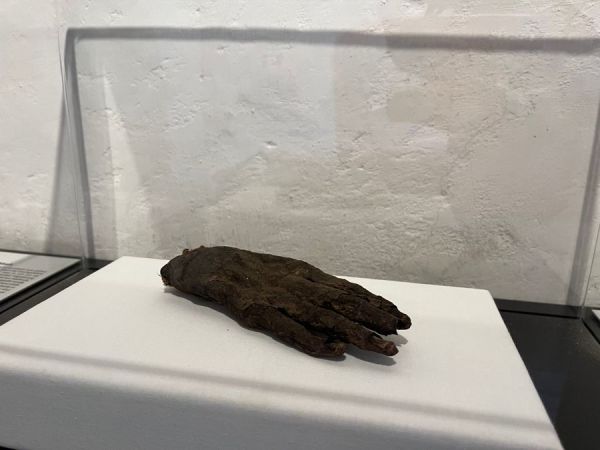 This creepy dried hand was a Gruyères mystery for hundreds of years, until modern science reveal it belonged to a mummy.