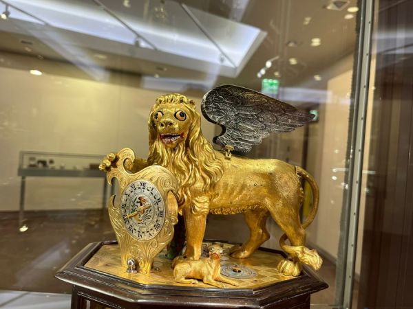 This golden googly-eyed lion and his dog deserve better.