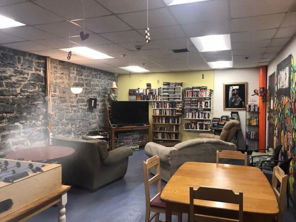 The basement common area—books abound throughout the hostel!