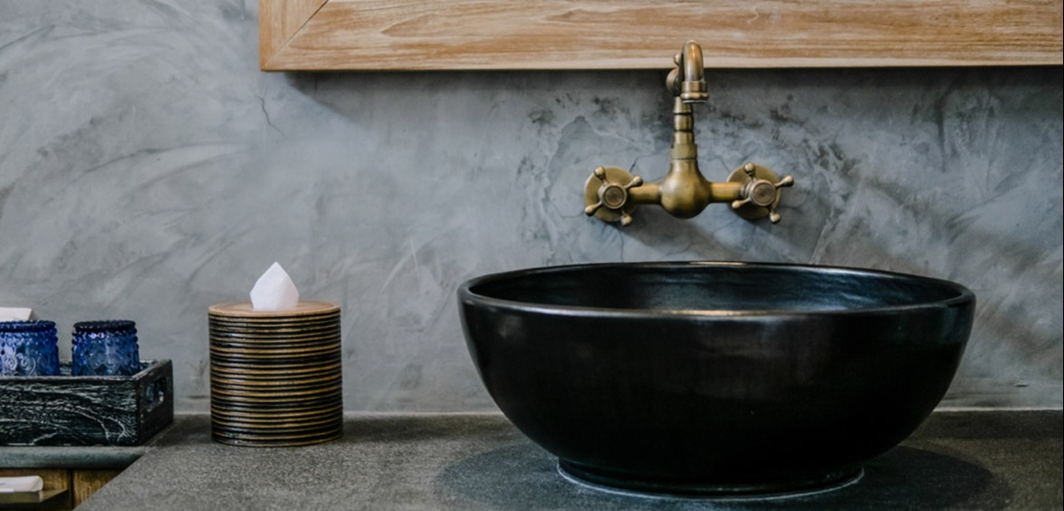 black bowl sink and brass faucet