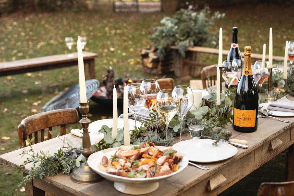 A garden party with table dressed with Champagne
