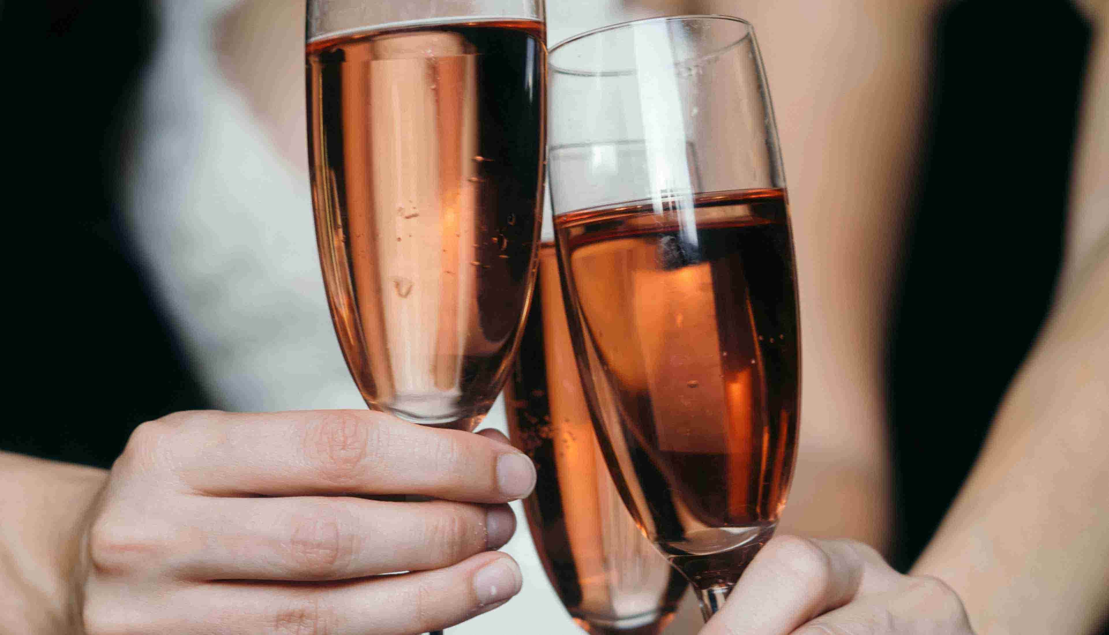 Three glasses of wine filled with rosé