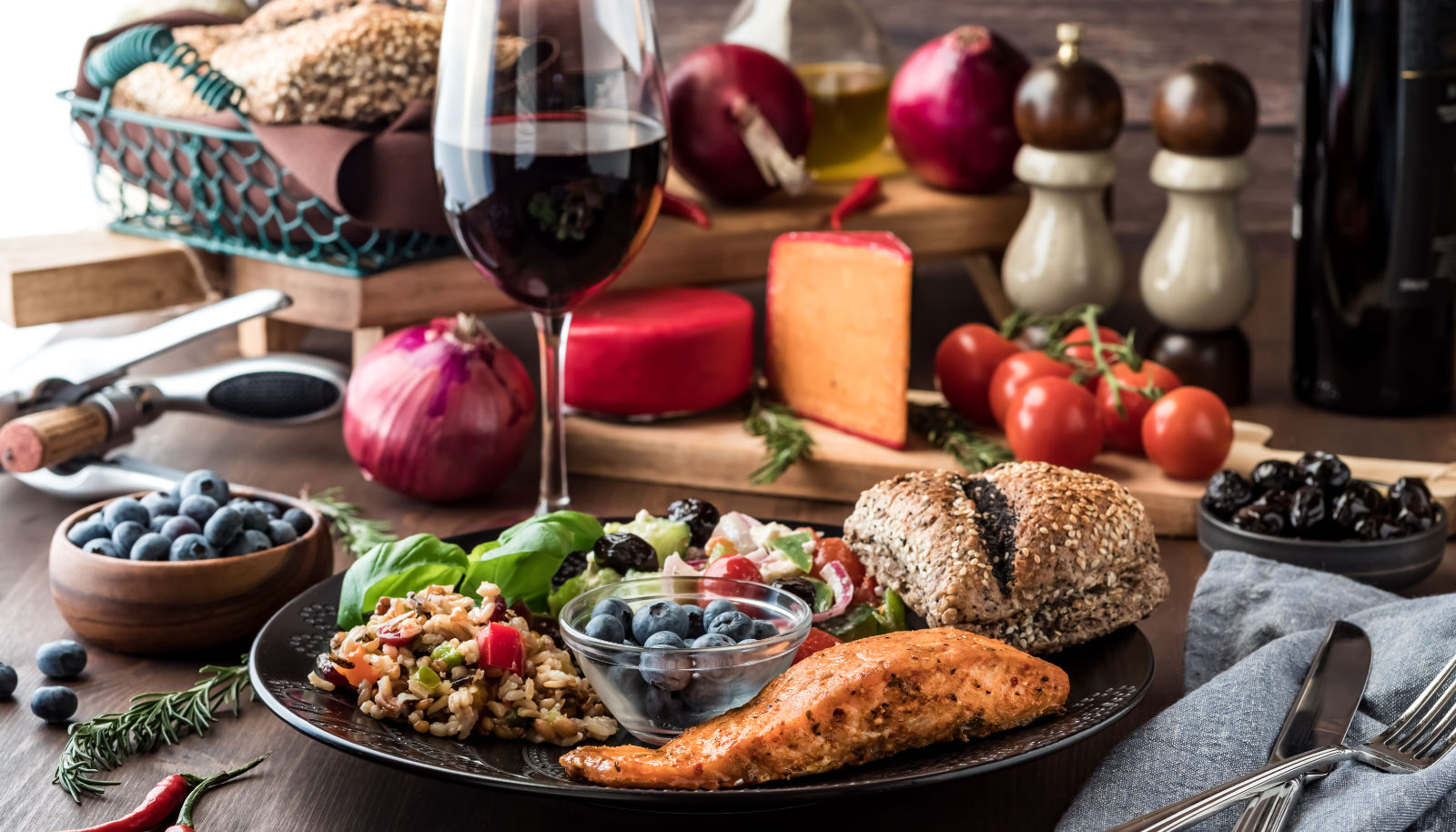 A salmon fillet dish accompanied with a glass of red wine - wine with salmon