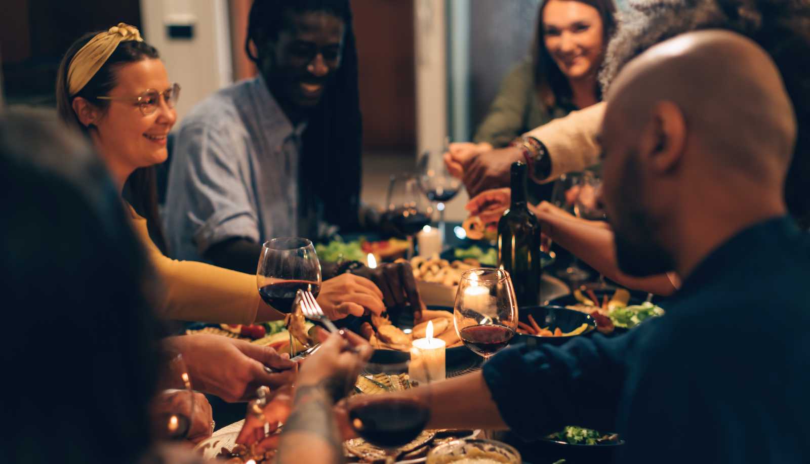Vegan wine - friends sharing a vegan meal with wine