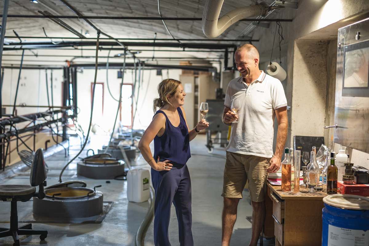Our buyer Sarah with winemaker looking at rosé production