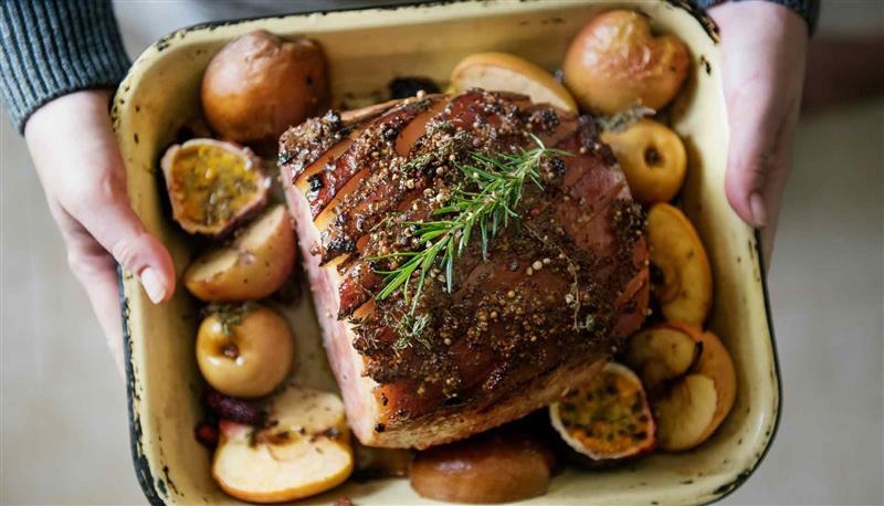 A dish of roast gammon with vegetables 