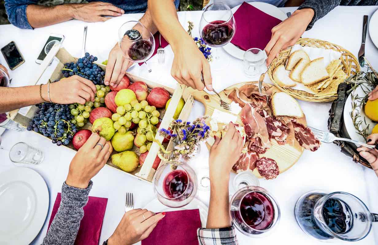 A garden party celebrating Mother's Day with red wine