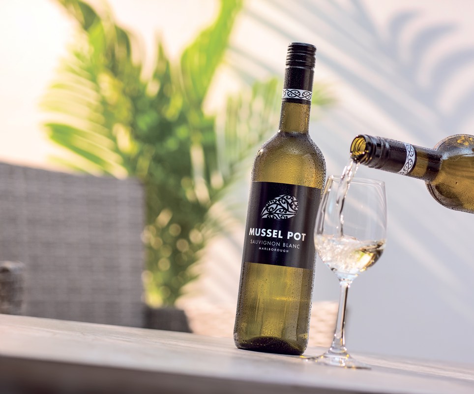 Screw cap Mussel Pot Sauvignon Blanc wine poured into a glass