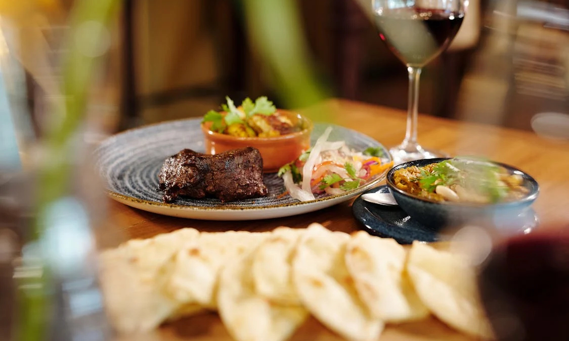 Red wine and food on table 