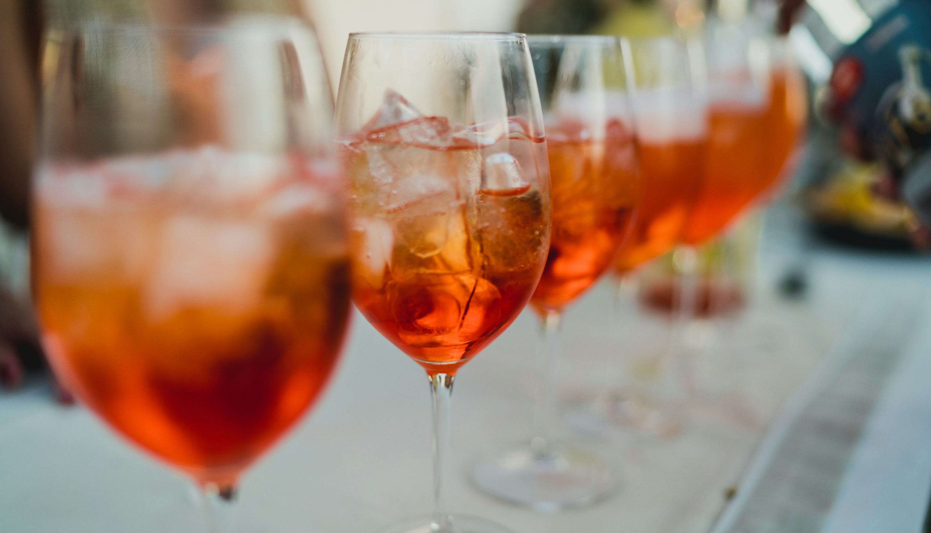 Aperol Spritz cocktails lined up 