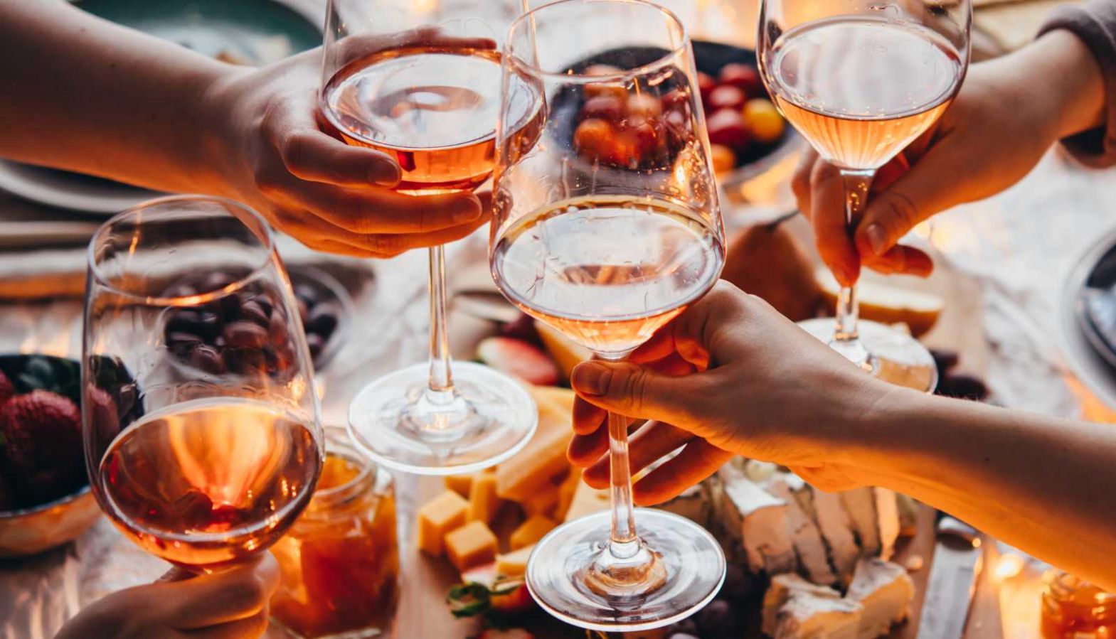Is rosé wine sweet or dry? - friends toast their glasses of rose wine