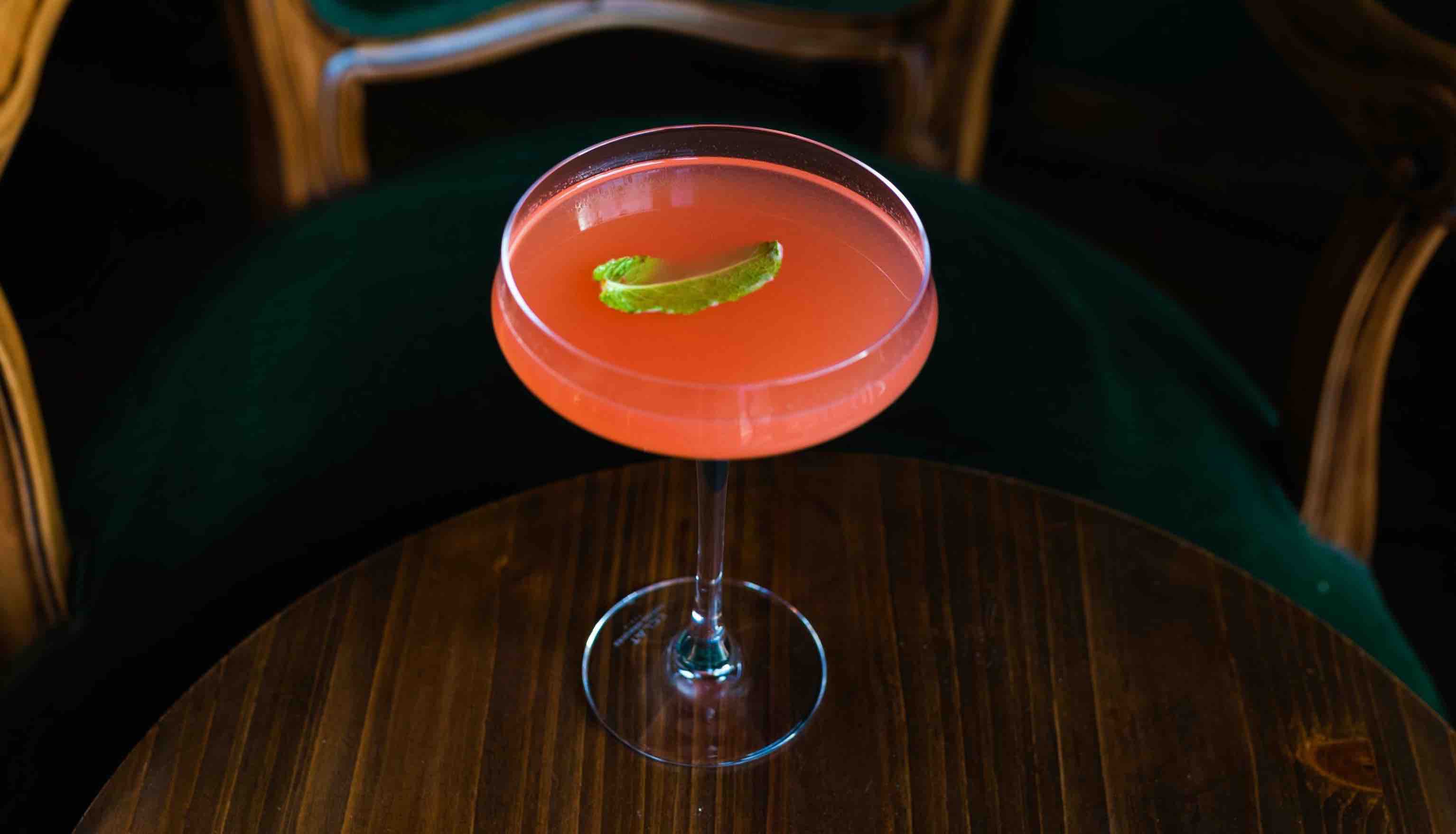 A Cosmopolitan cocktail on a table