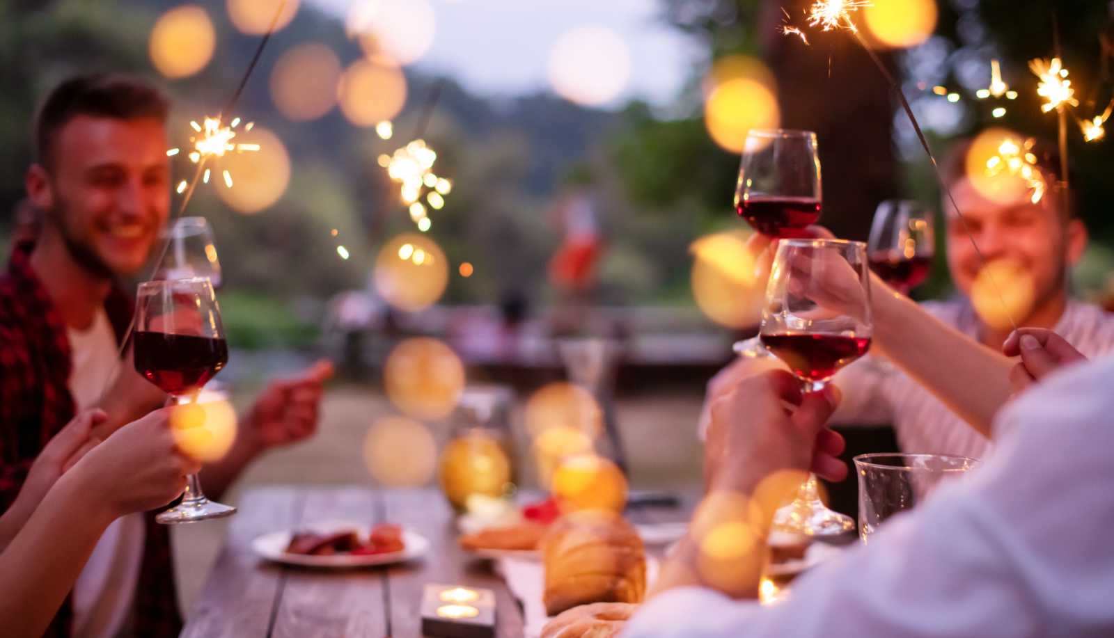 Friends enjoying red wine at a barbecue - light red wine