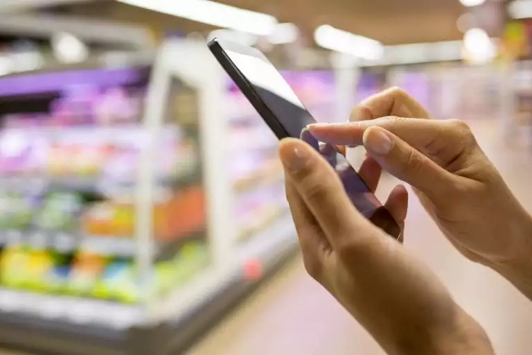 stock image of person on their phone