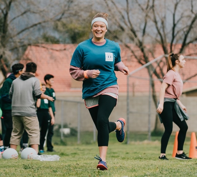 Women running outside on a field