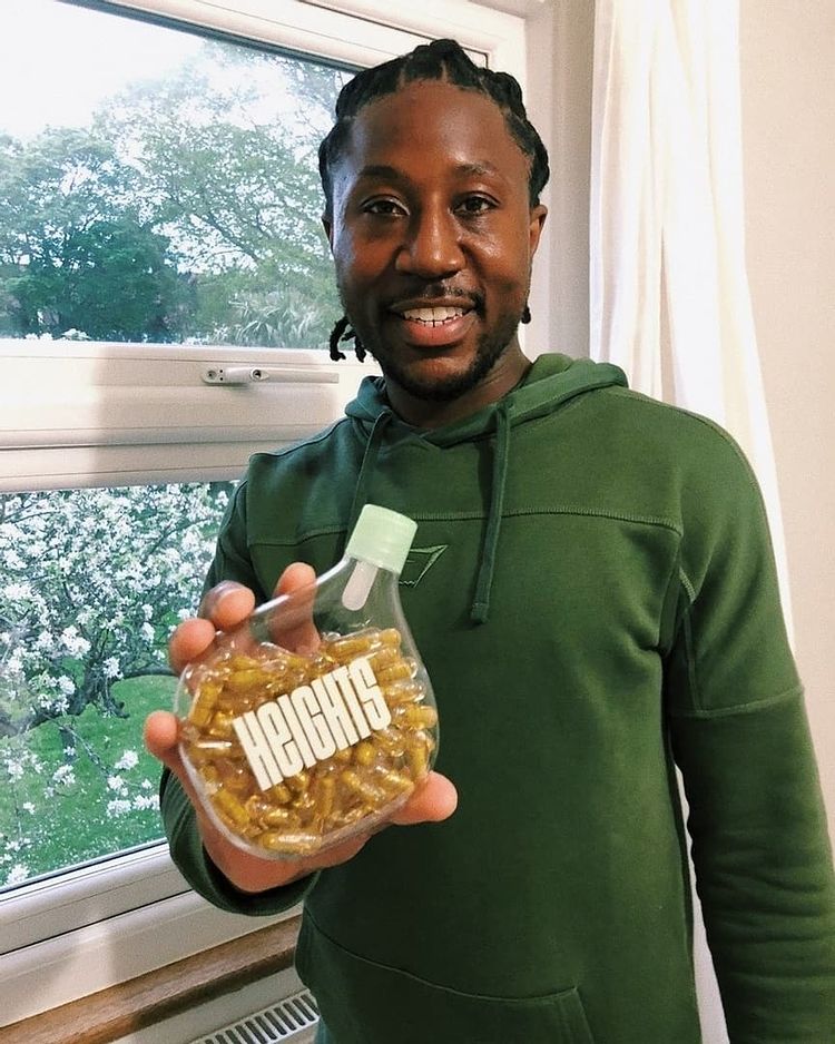Jonnie Moore, Heights customer, holding the Smart Supplement
