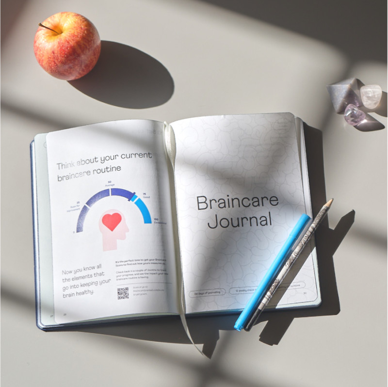 Braincare journal with apple and pen