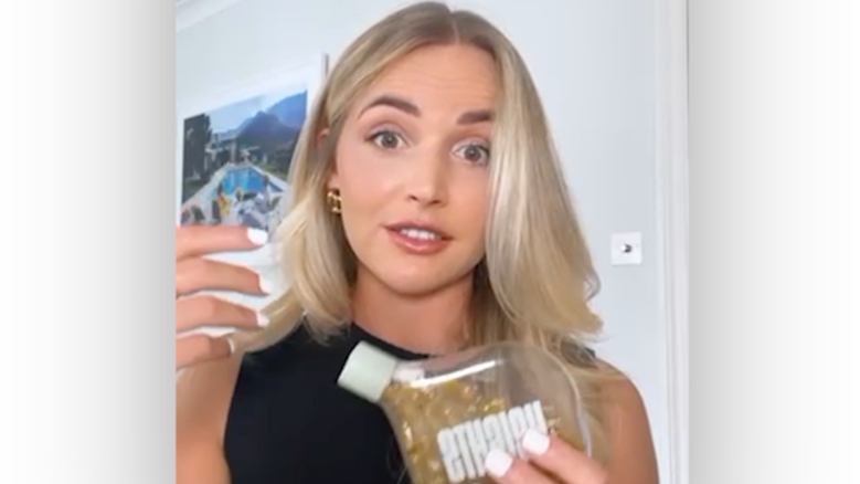 Emily English holding the Smart Supplement